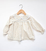 Sally Top in Ducklings (#75) with Blue Superfine Twill (#38) and Small White Lace (Trim B)